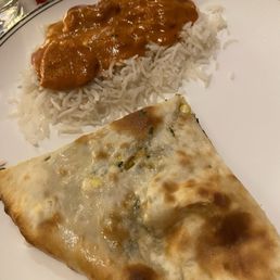 Spinach & cheese stuffed Nan, butter chicken over rice Spinach & cheese stuffed Nan, butter chicken over rice