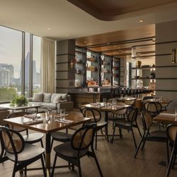 Warm and Inviting Main Dining Space at Tesserae, Buckhead. Enjoy a sophisticated meal in a modern setting, with comfortable s...