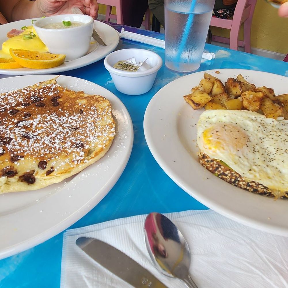 The Breakfast Cottage - Chocolate chip pancakes, avocado toast with over easy eggs and hash brown / skillet potatoes. - Breakfast & Brunch Near Me - Nokomis, Florida