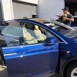 Joe Auto Glass - Expertly installing windshields on Tesla vehicles with precision craftsmanship and attention to detail, ensuring a perfect fit and optimal s