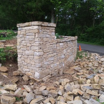 Breena Structural Innovations LLC - a pile of rocks and a fire hydrant - General Contractors Near Me