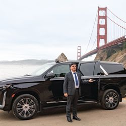 Black Car Booking - Chauffeur by his car