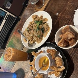 Cream cheese wontons, chicken pad sew ew, and side of crispy pork with a Thai tea Cream cheese wontons, chicken pad sew ew, and side of crispy pork with a Thai tea