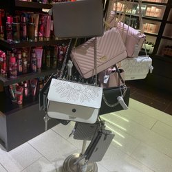 Victoria's Secret & PINK - Purses in checkout line.
