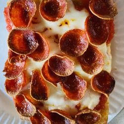 New York Squares - Pepperoni, and I mean the real deal with flavor and look at the cheese. Ordered this slice with extra pepperoni too! FORGET ABOUT IT!!!