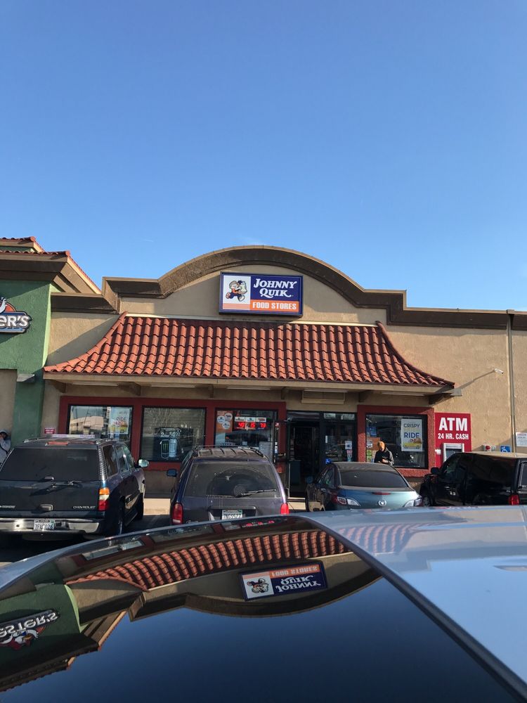 Johnny Quick Store Logo