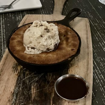 Tiny Boxwoods - Chocolate chip skillet cookie with ice cream - New American Near Me - Houston, Texas Tiny Boxwoods - Chocolate chip skillet cookie with ice cream - New American Near Me - Houston, Texas
