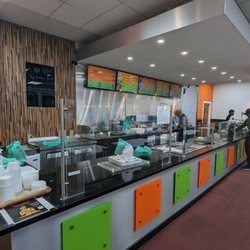 Chaat House - The counter where you order and collect food. You're typically given an order number.