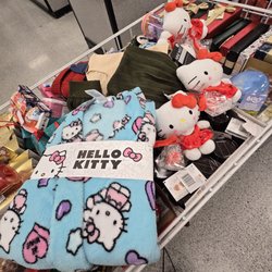 A Hello Kitty robe and a few plushies with mini candy canes