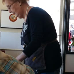 a woman eating a donut