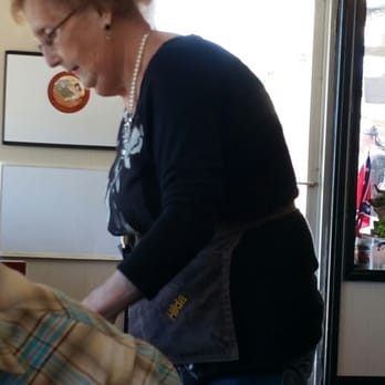 Edna's Cafe - a woman eating a donut - American Near Me - Green Forest, Arkansas