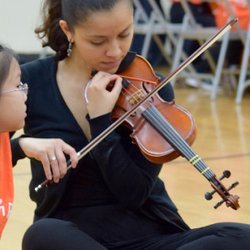 Kids Orchestra - Kids' Orchestra Teaching Artist working with her students.