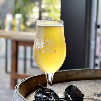 Roses By The Stairs Brewing - a glass of beer on a barrel - Breweries Near Me - Phoenix, Arizona Roses By The Stairs Brewing - a glass of beer on a barrel - Breweries Near Me - Phoenix, Arizona
