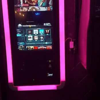 The Rock - a video game machine lit up in pink - Gay Bars Near Me - Phoenix, Arizona