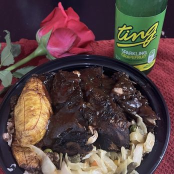 The Bleu Room - Jerk chicken with jerk sauce; rice and peas with oxtail gravy; cabbage and plantain. Grapefruit Ting. - Caribbean Near Me - New York, New York