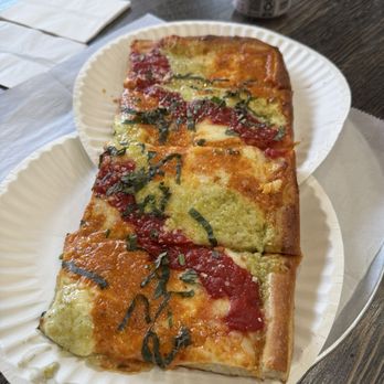 Romano Pizza - Sicilian rainbow pizza with red sauce, vodka sauce and pesto. - Italian Near Me - Weehawken, New Jersey Romano Pizza - Sicilian rainbow pizza with red sauce, vodka sauce and pesto. - Italian Near Me - Weehawken, New Jersey