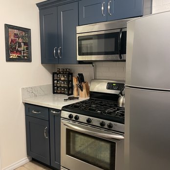 New Concept Cabinet - Custom cabinets above the microwave and "pull out" Spice rack next to the stove - Cabinetry Near Me - Whittier, California
