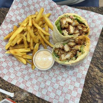Pesto Cafe and grill - Buffalo chicken wrap with french fries - Sandwiches Near Me - Miami, Florida Pesto Cafe and grill - Buffalo chicken wrap with french fries - Sandwiches Near Me - Miami, Florida