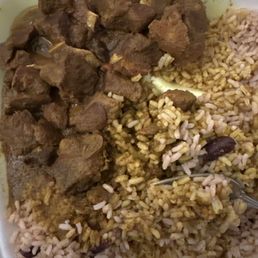 Curry goat, and rice with peas Curry goat, and rice with peas