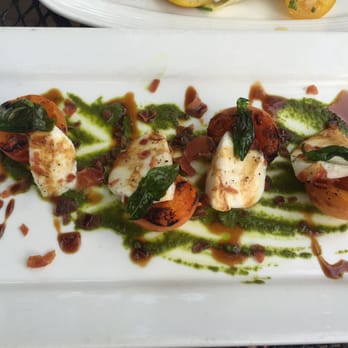 Volcano Union Inn + Pub - Grilled apricots with mozzarella, crispy prosciutto, cherry tomatoes and pesto. - Bed & Breakfast Near Me - Volcano, California Volcano Union Inn + Pub - Grilled apricots with mozzarella, crispy prosciutto, cherry tomatoes and pesto. - Bed & Breakfast Near Me - Volcano, California