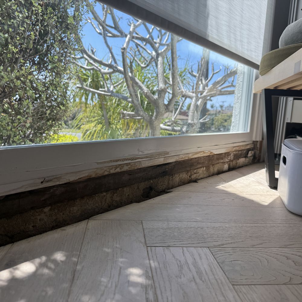 American Pride Builders - Before: Rotten wood framing on portrait window - General Contractors Near Me - South Gate, California American Pride Builders - Before: Rotten wood framing on portrait window - General Contractors Near Me - South Gate, California