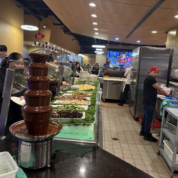 Daly Buffet - Way in back is the chockate fountain and mine cake squares behind sushi - Buffets Near Me - Daly City, California Daly Buffet - Way in back is the chockate fountain and mine cake squares behind sushi - Buffets Near Me - Daly City, California