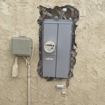 FSS Plastering - Before picture.  Had a new electrical box installed.  This was what I asked FSS to fix. - Stucco Services Near Me