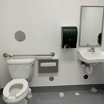 Rotten Robbie - a toilet and sink in a public restroom - Gas Stations Near Me - Mountain View, California