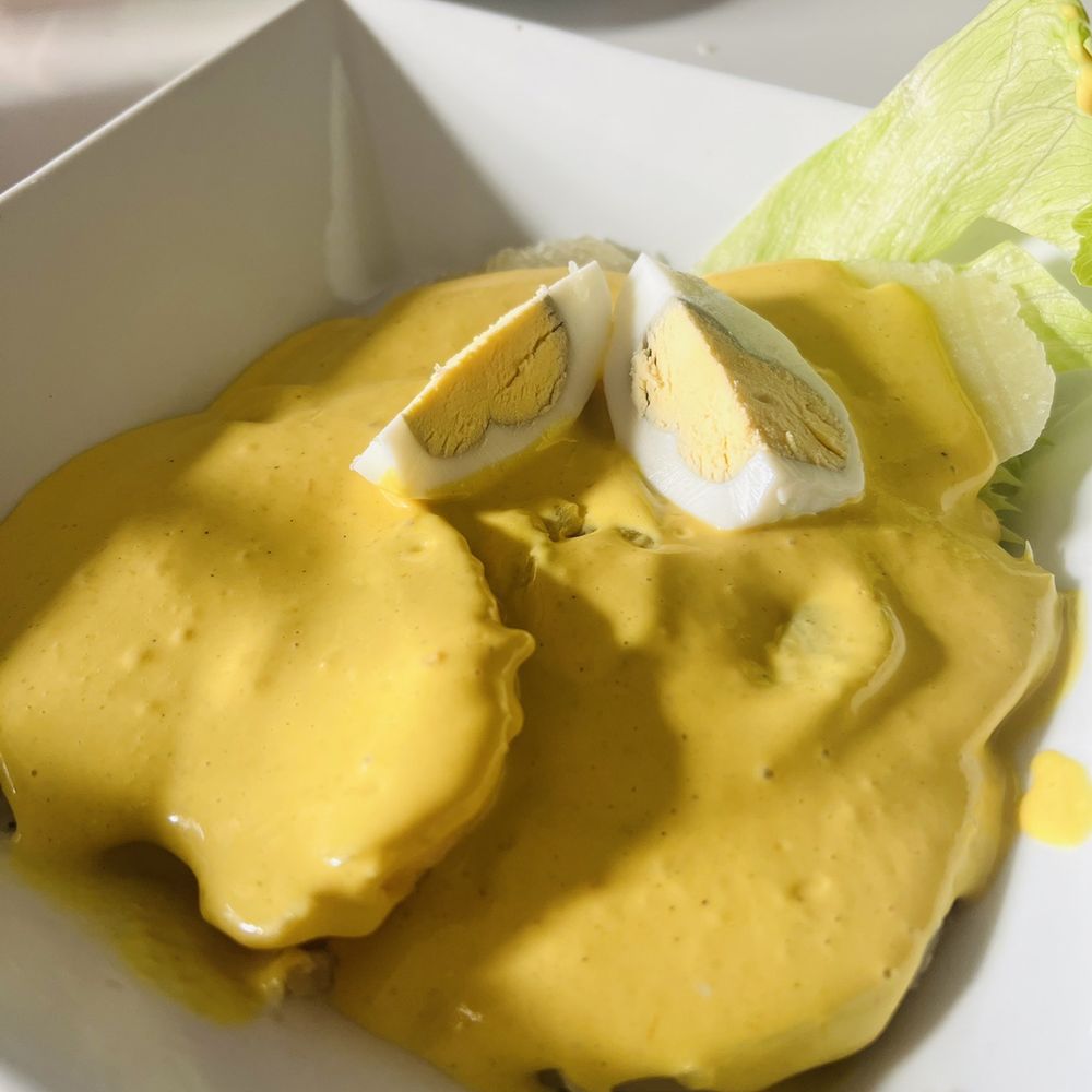 Mamita Peruvian Restaurant - Papa A La Huancaina: boiled potatoes served with a creamy garlic/ cheese sauce. - Peruvian Near Me - Glendale, California