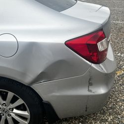 All New Again Paintless Dent Repair - Honda Civic  Note: black grease mark to right of dent was there prior to accident.