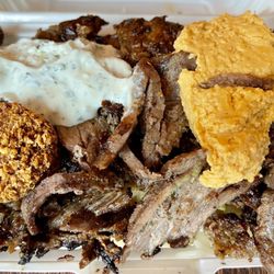 Omg Oh My Gyro - Beef Plate with falafel, tzatziki, tahini, with fries and rice underneath. Size regular.