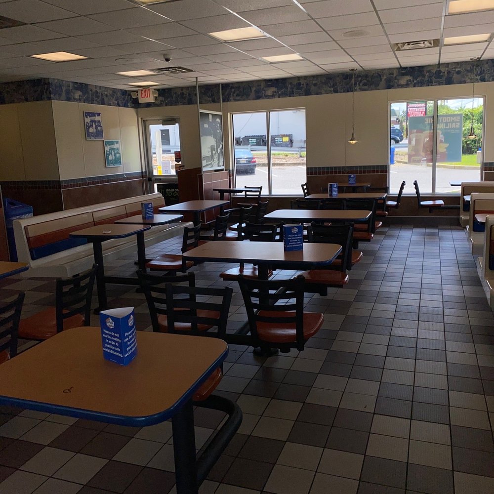 empty tables and chairs in a restaurant empty tables and chairs in a restaurant