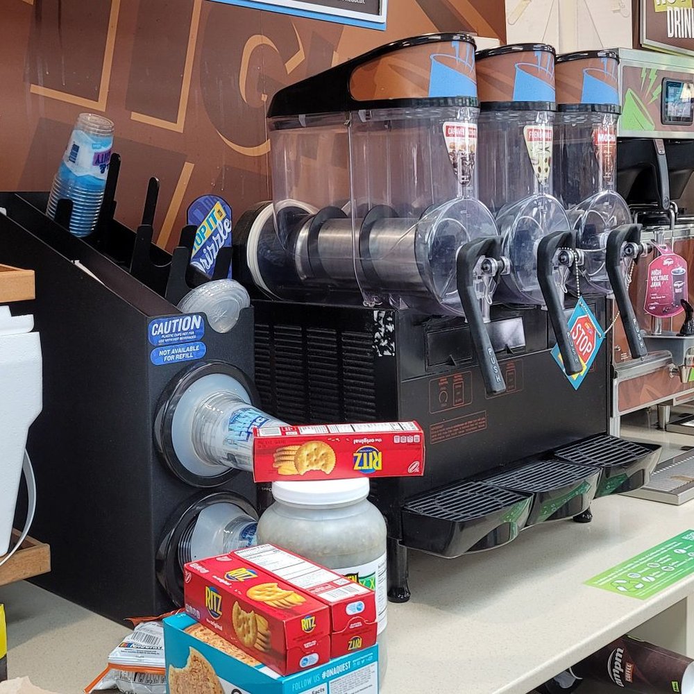 ampm - a coffee machine on a counter in a coffee shop - Convenience Stores Near Me - Palm Desert, California