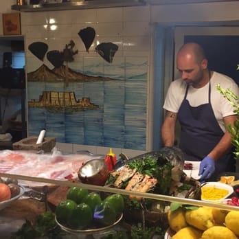 Pescheria Mattiucci - This guy made the crudo platters continuously throughout the night. Everyone starts with the raw fish and fruit platter. - Seafood Near Me - Naples, NA