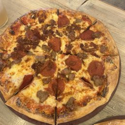Pepperoni and sausage pizza from happy hour menu Pepperoni and sausage pizza from happy hour menu