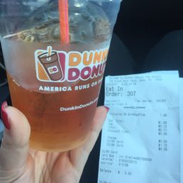 My small green tea (correct order) and receipt charging me for a Fruited Mango Pineapple tea. Does it look like there is any fruit?