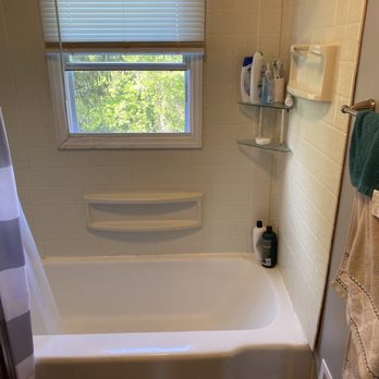 Prime Plumbing - Original cast iron bathtub with surround - Plumbing Near Me