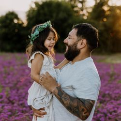 Becca Jean Photography - Dad and daughter laughing in an Oregon wildflower field