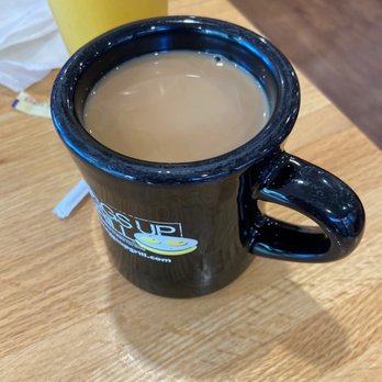 Eggs Up Grill - a cup of coffee on a table - Waffles Near Me - Greenville, South Carolina Eggs Up Grill - a cup of coffee on a table - Waffles Near Me - Greenville, South Carolina