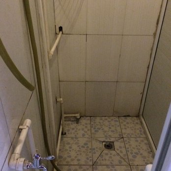 G Adventures - The gross shower at Beijing hostel. - Travel Services Near Me - Toronto, Ontario