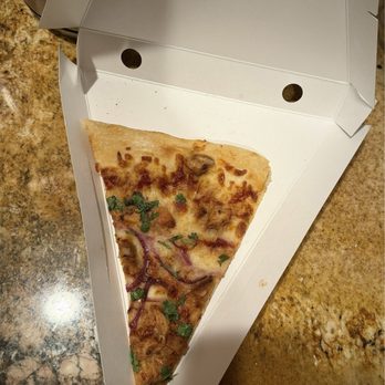 Wolfgang Puck Express - It might be hard to tell from the picture, but previously the slice would fill the entire box. - Pizza Near Me - Valley Village, California Wolfgang Puck Express - It might be hard to tell from the picture, but previously the slice would fill the entire box. - Pizza Near Me - Valley Village, California