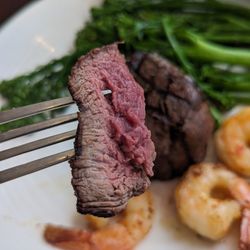 Manly Grill - 200g Gippsland Eye Fillet steak cooked medium rare with chargrilled broccolini and added 3 chili garlic prawns