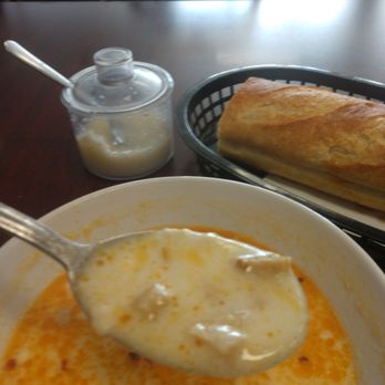 Sofia Grill - Close up of the tripe soup on my spoons with red and garlic pickled garlic I think - Bulgarian Near Me - Des Plaines, Illinois Sofia Grill - Close up of the tripe soup on my spoons with red and garlic pickled garlic I think - Bulgarian Near Me - Des Plaines, Illinois