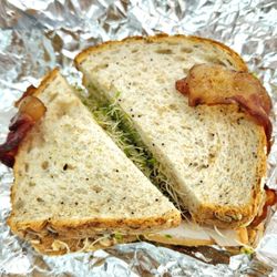 Lunch Break - California Turkey (Smoked turkey, swiss chs, bacon, sprouts, avocado on 12 grain bread - no mayo, tomato), $7.99. Very filling.