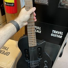 Travel Guitar is a full scale tiny guitar Travel Guitar is a full scale tiny guitar
