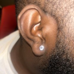 Golden 7 Tattoo - My brother's terribly placed ear piercing.