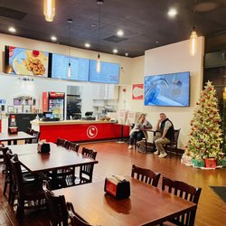 Curry Pizza House San Ramon - Dining area and order bar.