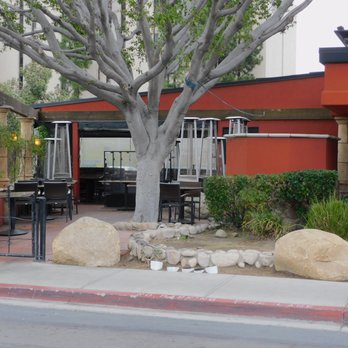 BJ's Restaurant & Brewhouse - Employees area for seating outside area and the smoking area . - Pizza Near Me - La Mesa, California