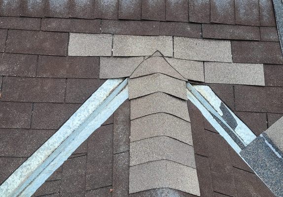 Womack's Roof Repairs Logo
