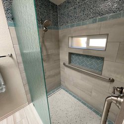 M2 Enterprise - The conversion to a lipless, safe large shower. Note the beautiful tile work, and 4 foot grab bar!